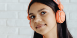 Teenage girl wearing noise cancelling headphones, showing NDIS assistive technology that supports focus, sensory regulation and everyday independence