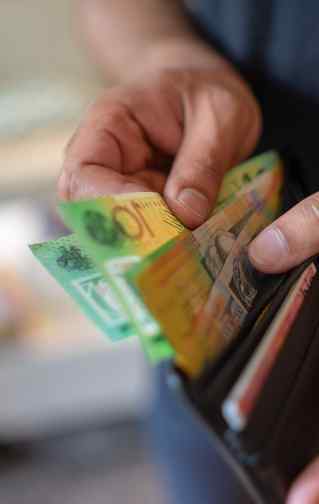 Man opening wallet to donate Australian money