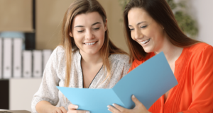 Two professionals meeting to discuss a Supported Independent Living transition, reflecting Lifely’s support for unregistered SIL providers planning to exit while protecting participants, staff and continuity of care.