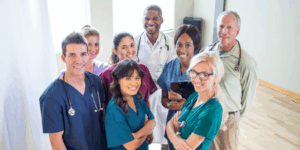 A diverse group of doctors, showing how **doctors and the NDIS** work together to explain disability, provide medical evidence and support everyday life needs.