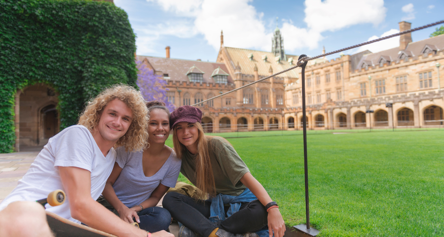 OSHC: University students sit on the grass at Melbourne University