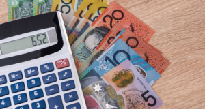 Federal budget 2023 NDIS : Australian currency and a calculator